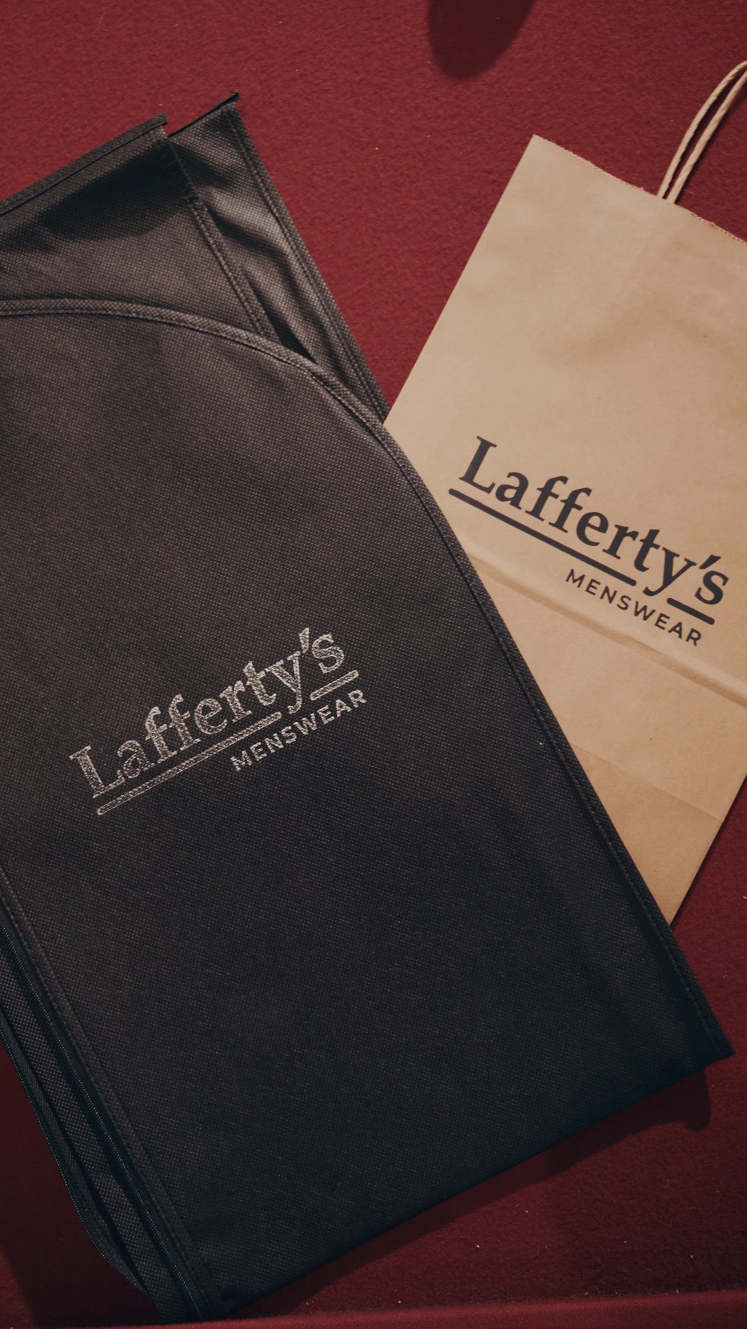 Branded Lafferty's Menswear garment bag and shopping bag, ready to take home